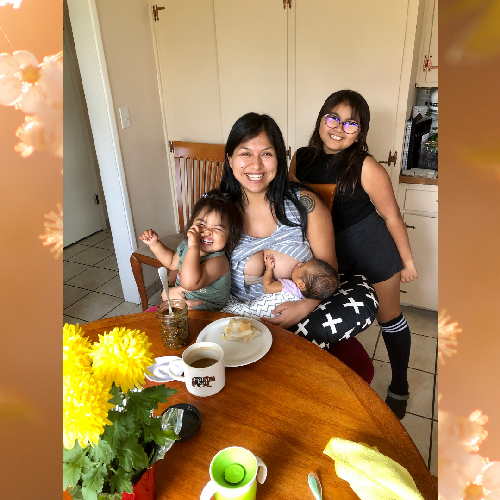 Mother and daughters at a table. 